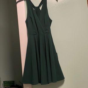 Lulus dark green dress, mid length. Twist back. brand new tags attached.